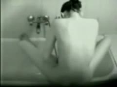 A concealed camera captures the wet wife masturbating in the restroom.